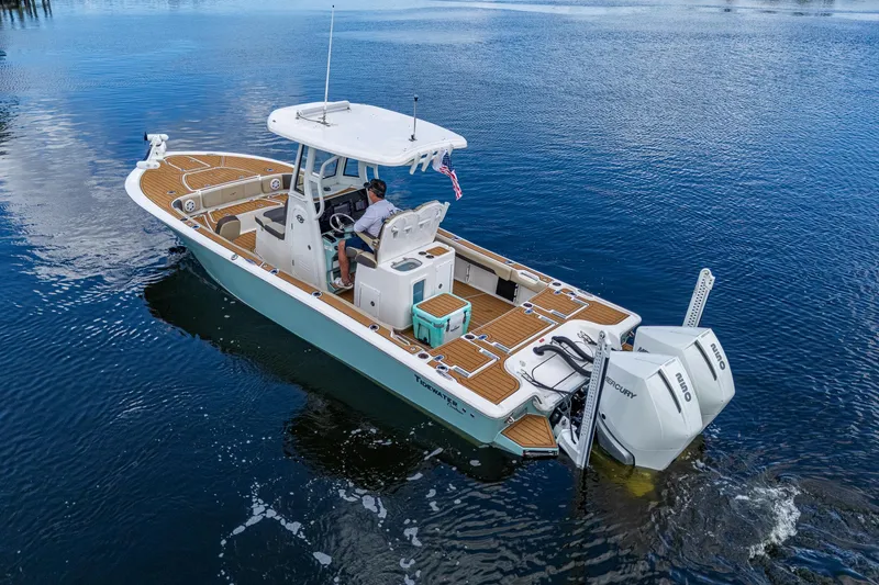 Slide: The Image of 2023 Tidewater 2700 Carolina Bay boat cruising on calm water. - 15