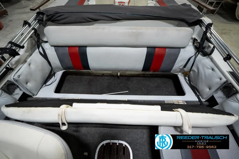 Slide: The Image of 1987 Hurricane 176 Deck Boat interior with seating and storage area. - 23