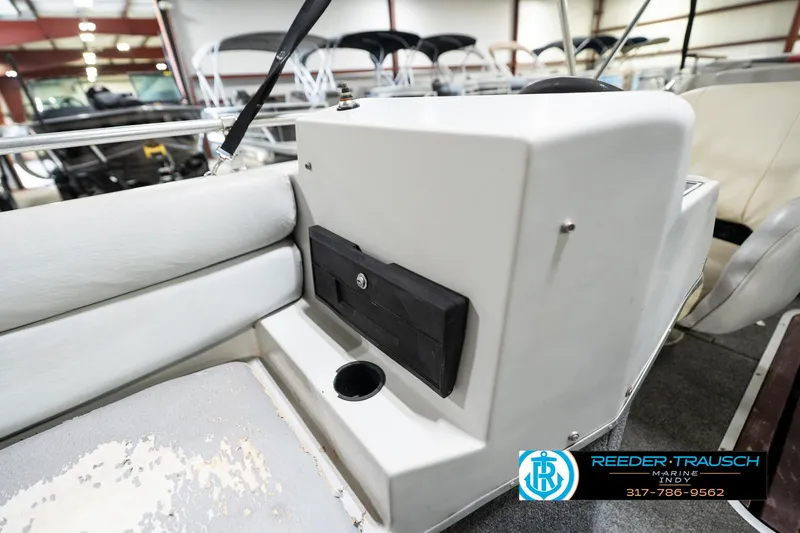 Slide: The Image of 1987 Hurricane 176 Deck Boat interior with seating and control panel, Reeder-Trausch Marine logo visible. - 34