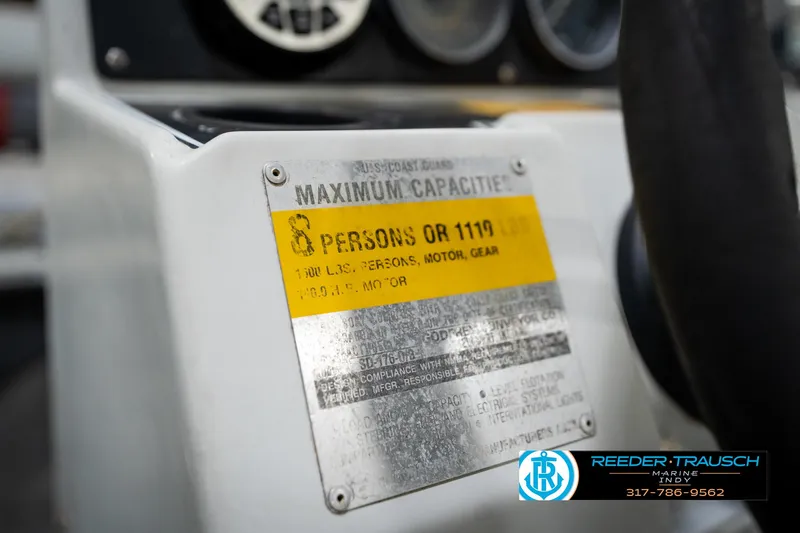 Slide: The Image of 1987 Hurricane 176 Deck Boat capacity plate, showing maximum load and passenger limits. - 48