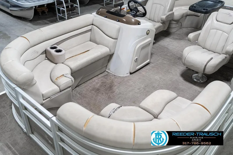 Slide: The Image of 2018 Bennington 20 SSRX pontoon boat interior with plush seating and steering console. - 12