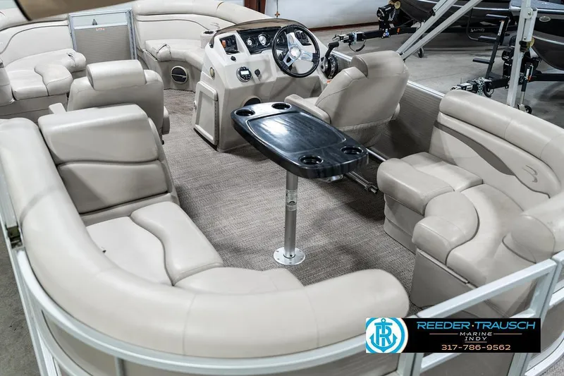 Slide: The Image of Luxurious interior of a 2018 Bennington 20 SSRX pontoon boat with plush seating and table. - 15
