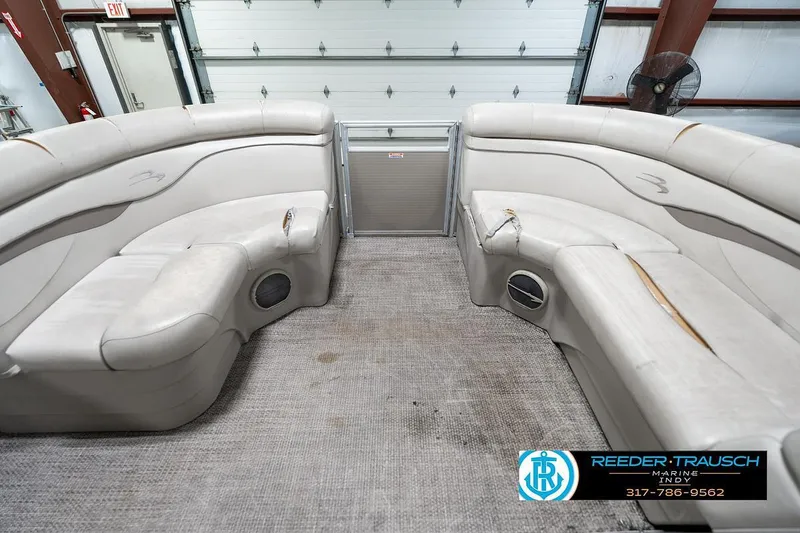 Slide: The Image of Interior of 2018 Bennington 20 SSRX pontoon boat with beige seating. - 22