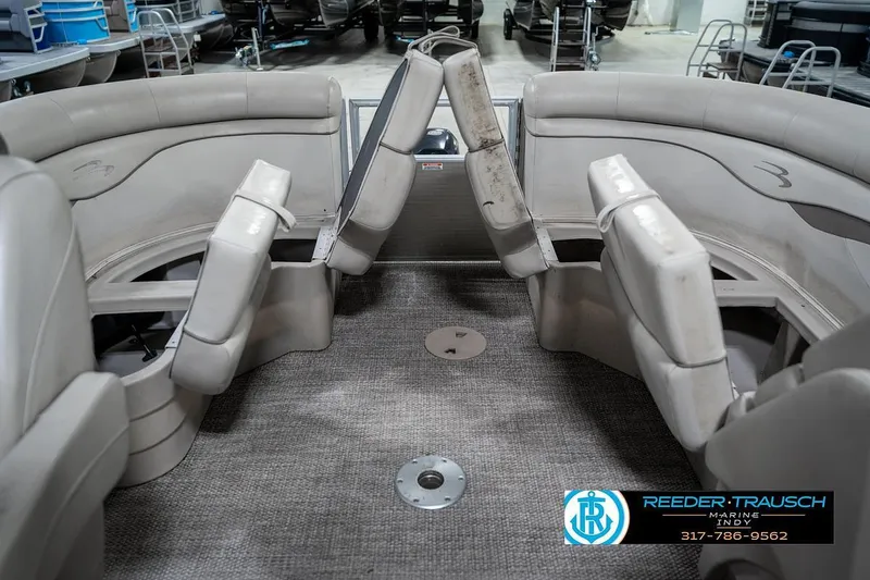 Slide: The Image of 2018 Bennington 20 SSRX boat interior with gray seating and carpet flooring. - 26