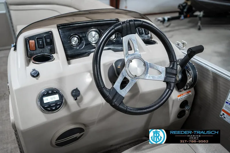 Slide: The Image of Steering console of a 2018 Bennington 20 SSRX pontoon boat with controls and gauges. - 28