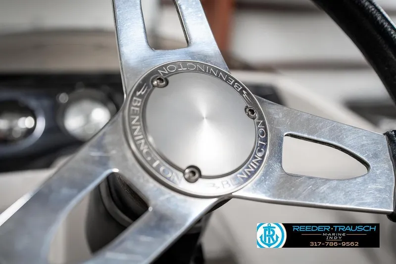 Slide: The Image of Steering wheel of 2018 Bennington 20 SSRX boat, featuring sleek metallic design. - 29