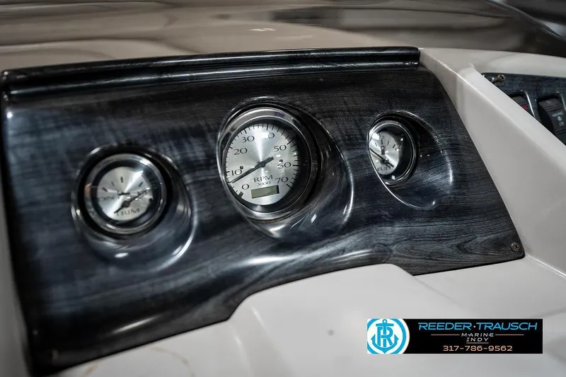 Slide: The Image of Dashboard of 2018 Bennington 20 SSRX with RPM and fuel gauges. - 32