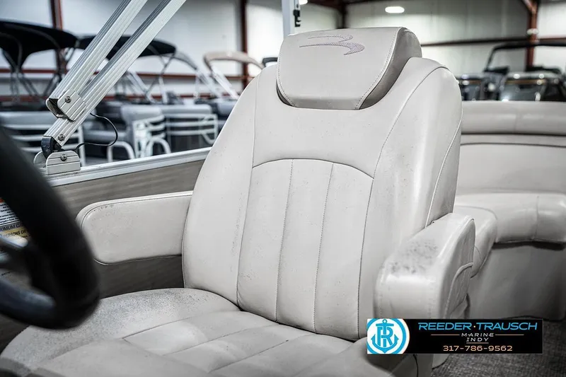 Slide: The Image of 2018 Bennington 20 SSRX boat seat in showroom, featuring comfortable white upholstery. - 35