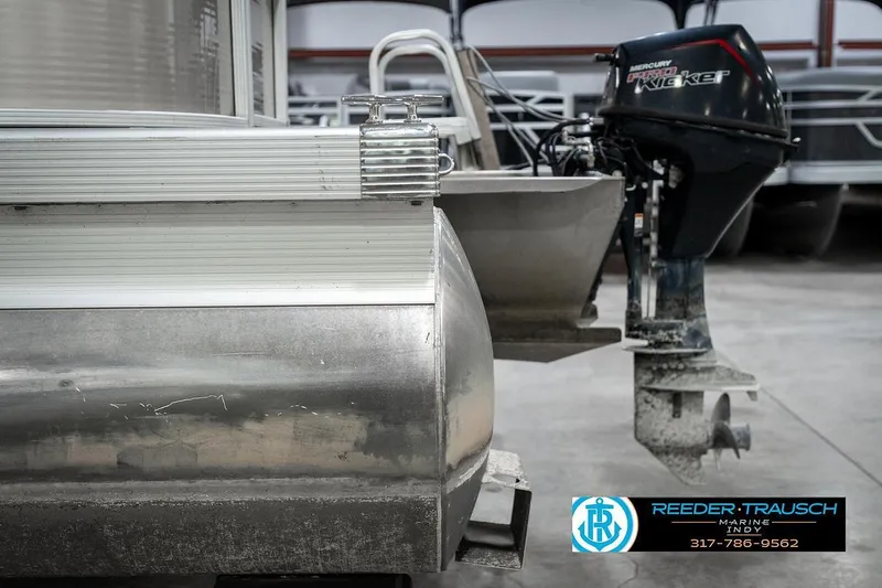 Slide: The Image of 2018 Bennington 20 SSRX pontoon boat with Mercury outboard motor in a showroom. - 39