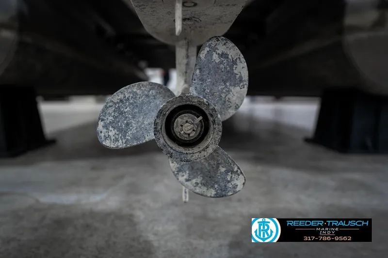 Slide: The Image of Close-up of a 2018 Bennington 20 SSRX boat propeller in a garage setting. - 42