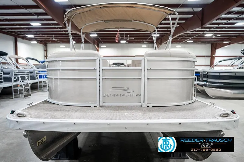 Slide: The Image of 2018 Bennington 20 SSRX pontoon boat in indoor showroom, rear view. - 5