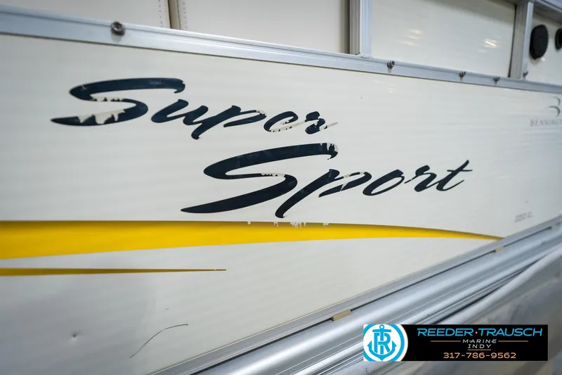 Slide: The Image of 2005 Bennington 2050 Super Sport boat with yellow accent and Reeder-Trausch Marine contact details. - 15