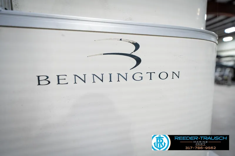 Slide: The Image of 2005 Bennington 2050 boat logo in a showroom setting. - 16