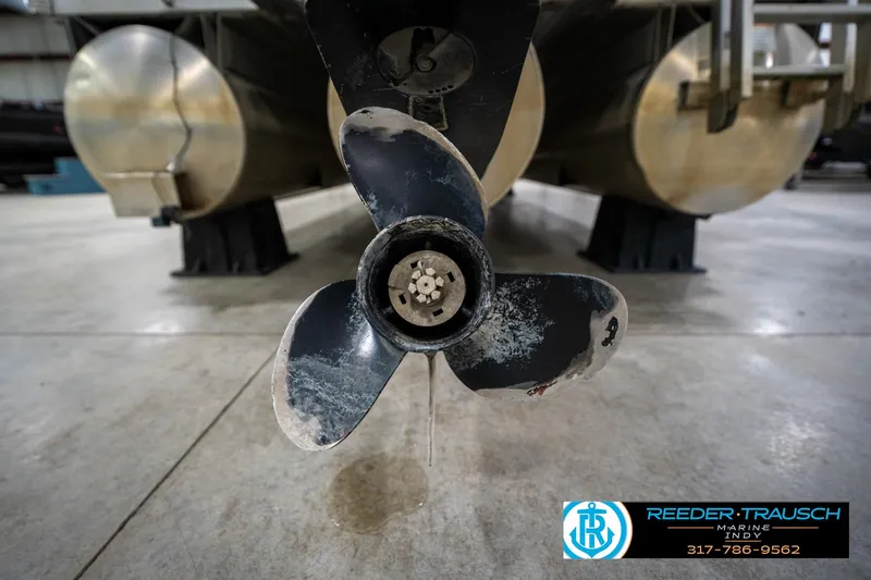 Slide: The Image of Close-up of a Bennington 2050 boat propeller, 2005 model, in a garage setting. - 20