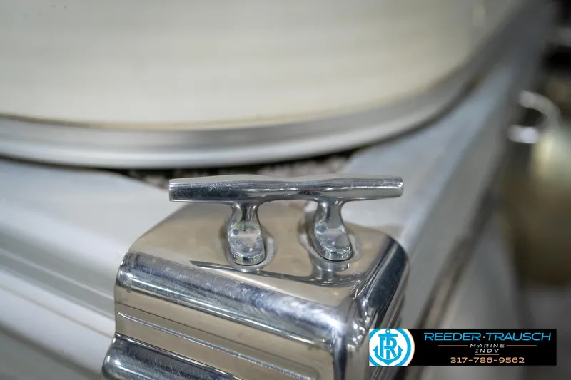 Slide: The Image of Close-up of a 2005 Bennington 2050 boat cleat, featuring Reeder Trausch Marine logo. - 23