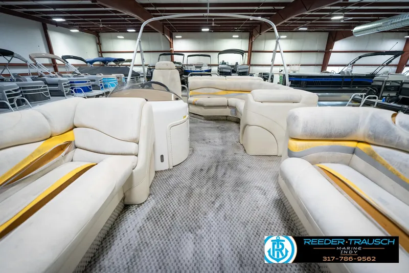 Slide: The Image of Interior of a 2005 Bennington 2050 pontoon boat in a showroom. - 24