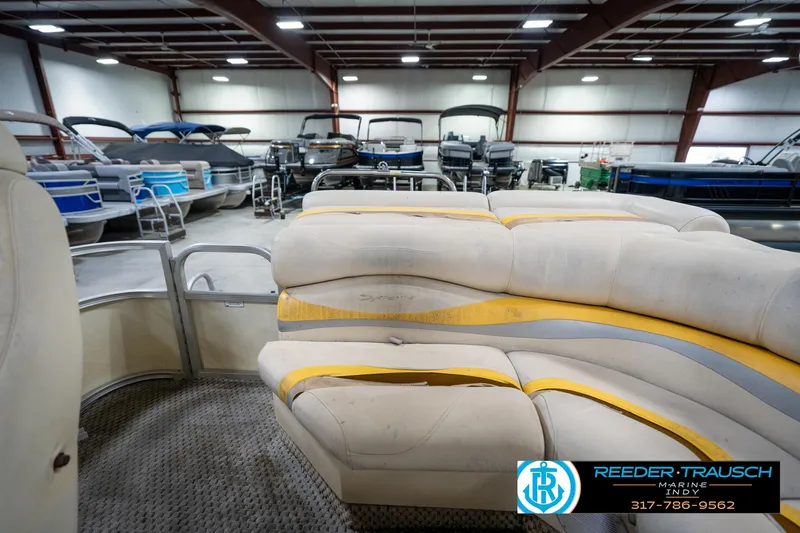 Slide: The Image of Interior of a 2005 Bennington 2050 pontoon boat in a showroom. - 26