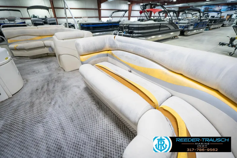 Slide: The Image of Interior of a 2005 Bennington 2050 pontoon boat with plush seating. - 30