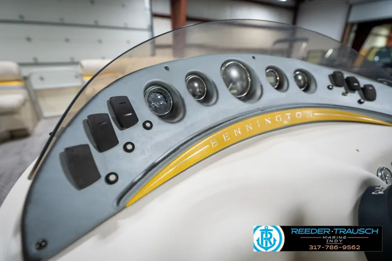 Slide: The Image of Dashboard of a 2005 Bennington 2050 boat with gauges and controls. - 34