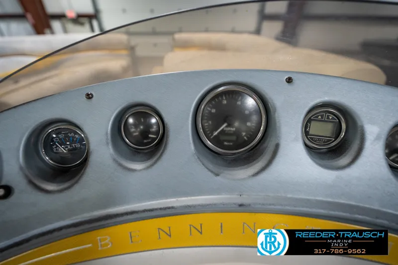 Slide: The Image of Dashboard of a 2005 Bennington 2050 boat with gauges and controls. - 35