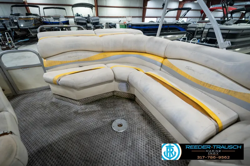 Slide: The Image of Interior of a 2005 Bennington 2050 pontoon boat with worn seating. - 38
