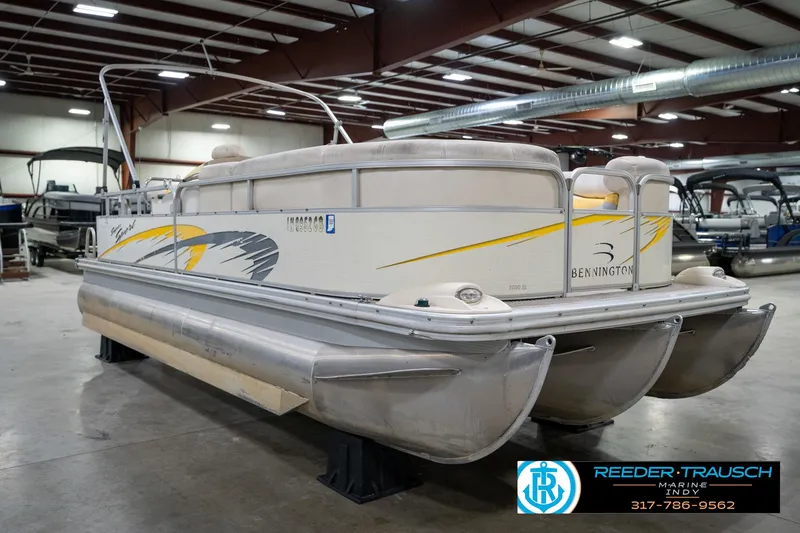 Slide: The Image of 2005 Bennington 2050 pontoon boat in indoor showroom, side view. - 4