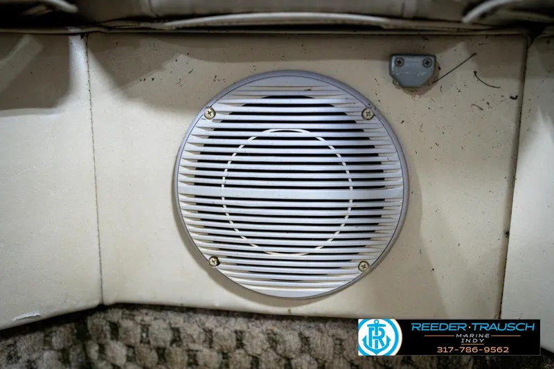 Slide: The Image of Speaker grill on a 2005 Bennington 2050 boat interior, with Reeder-Trausch Marine logo. - 42