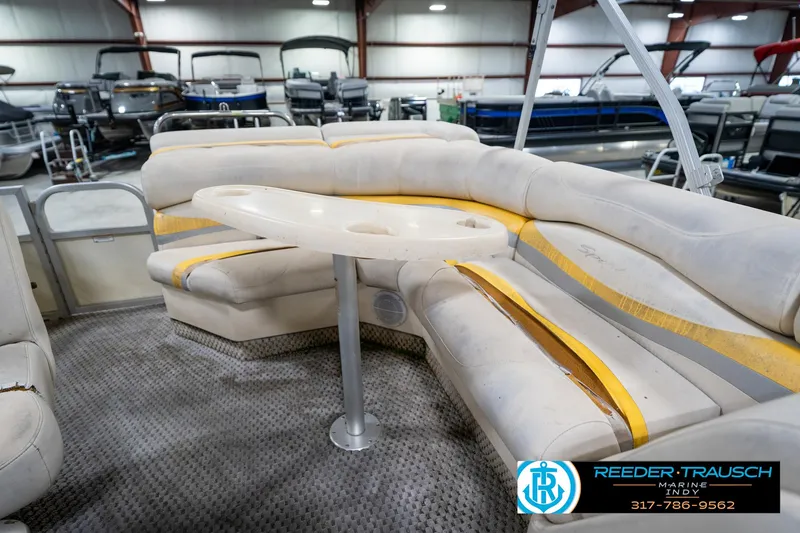 Slide: The Image of Interior of a 2005 Bennington 2050 pontoon boat with seating and table. - 43
