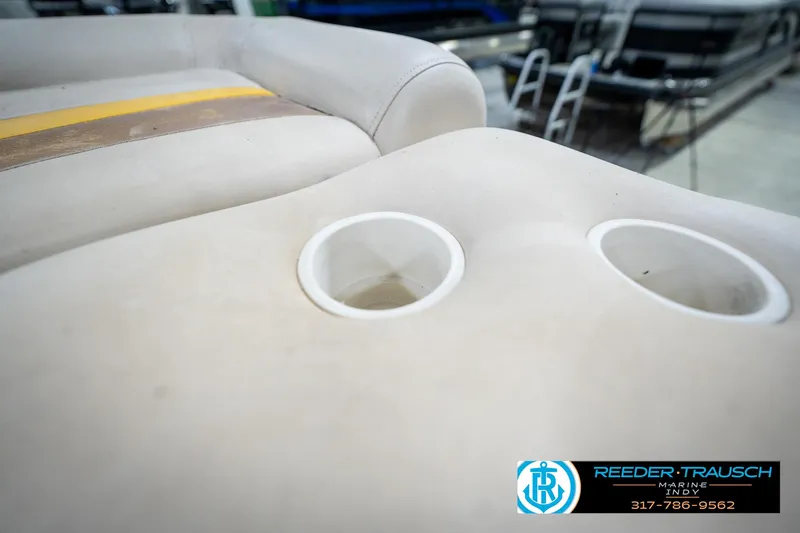 Slide: The Image of Close-up of a 2005 Bennington 2050 boat seat with cup holders. - 45