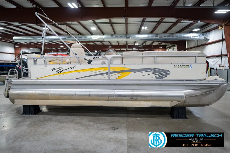 Slide: The Image of 2005 Bennington 2050 pontoon boat in indoor showroom, side view. - 5