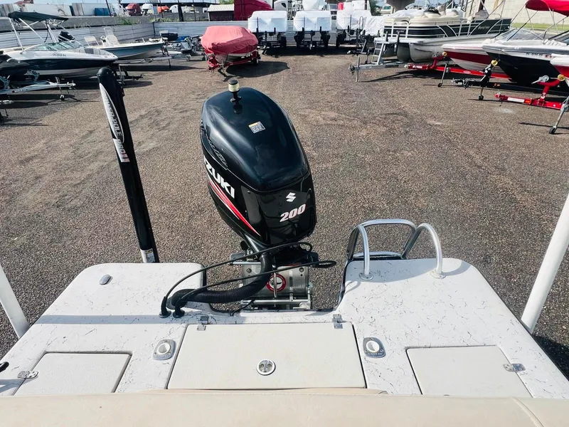 Slide: The Image of 2014 Blazer Bay 2200 Professional boat with Suzuki 200 outboard motor in a marina. - 10