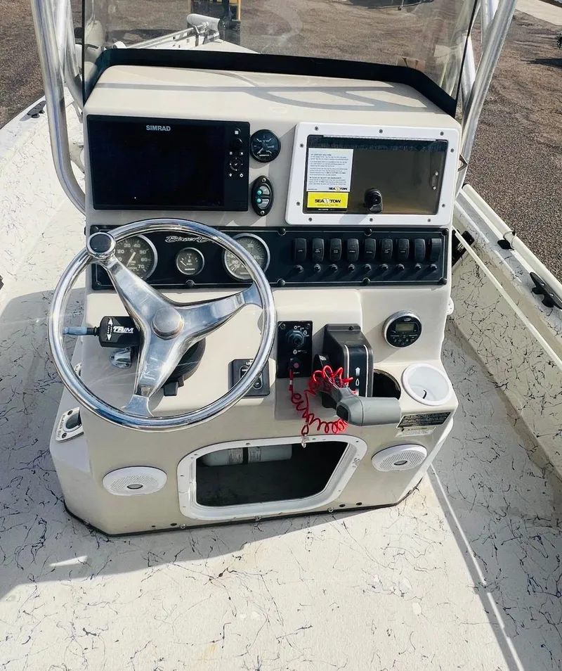 Slide: The Image of 2014 Blazer Bay 2200 Professional boat console with steering wheel and navigation controls. - 8