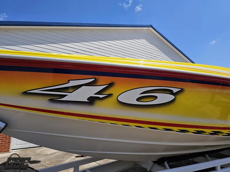 Slide: The Image of 2004 Sonic USA 45SS speedboat with vibrant yellow and red graphics, number 46 displayed. - 17