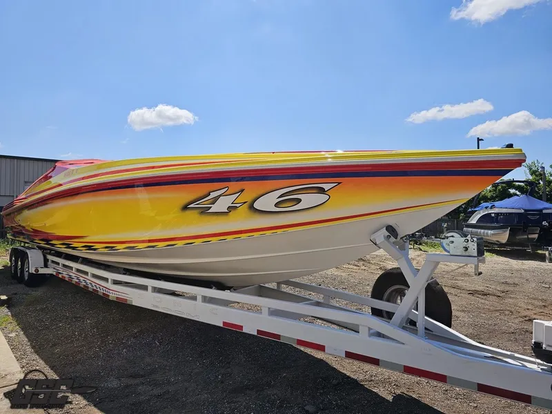 Slide: The Image of Bright yellow 2004 Sonic USA 45SS speedboat on trailer under clear blue sky. - 3