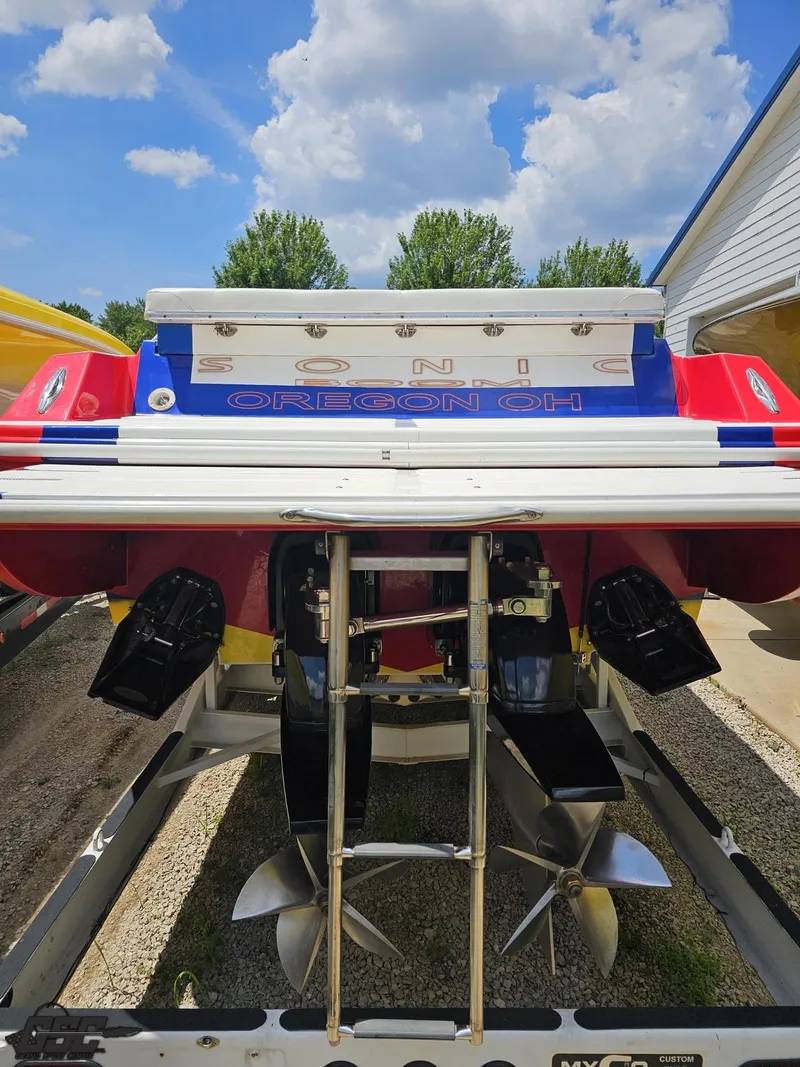 Slide: The Image of Rear view of a 2004 Sonic USA 45SS boat with dual propellers. - 30