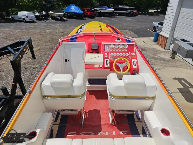 Slide: The Image of 2004 Sonic USA 45SS speedboat interior with vibrant dashboard and seating. - 37