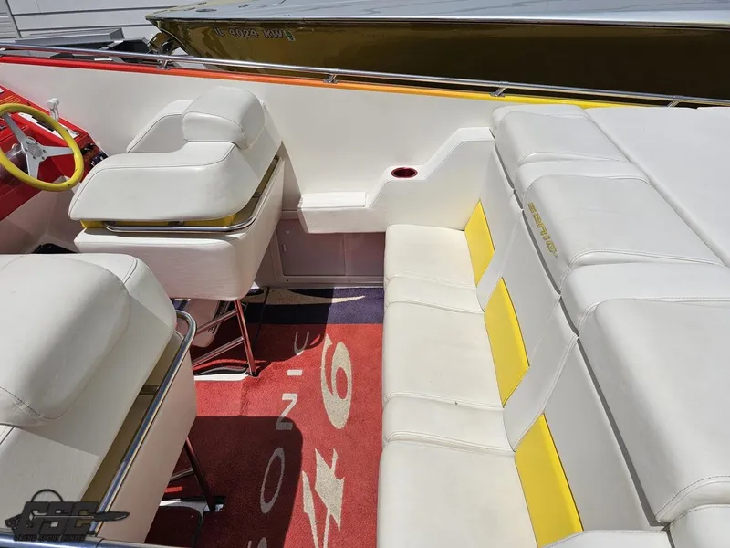 Slide: The Image of 2004 Sonic USA 45SS boat interior with white and yellow seating, red accents. - 41