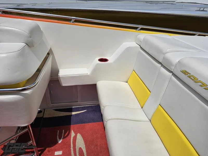 Slide: The Image of Interior of a 2004 Sonic USA 45SS boat with white and yellow seating. - 42