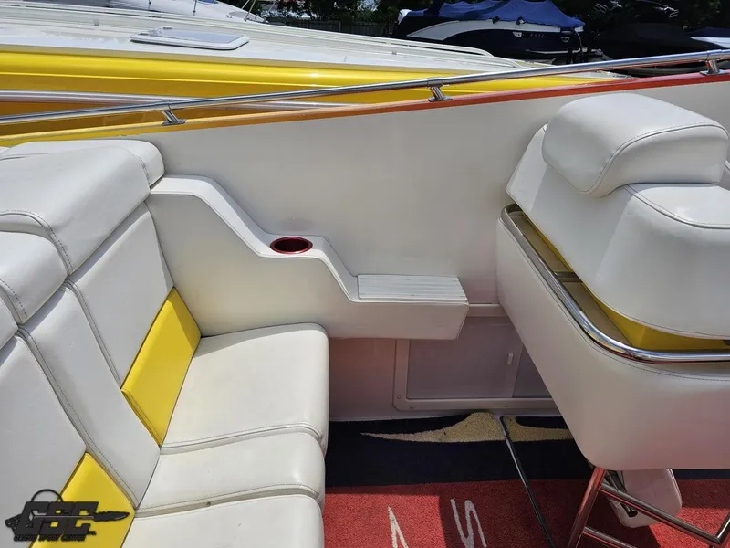 Slide: The Image of Interior of a 2004 Sonic USA 45SS boat with white and yellow seating. - 46