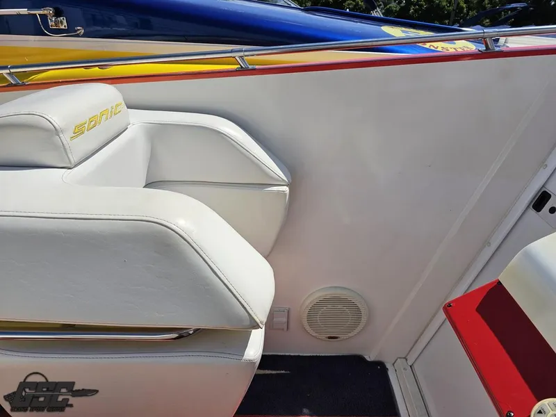 Slide: The Image of White leather seating on a 2004 Sonic USA 45SS boat, featuring sleek design and vibrant accents. - 48
