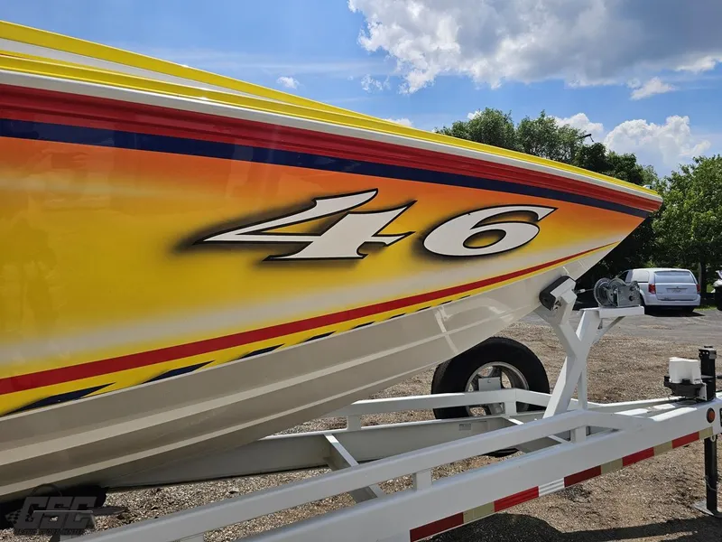 Slide: The Image of Yellow and red Sonic USA 45SS boat on trailer, sunny day, 2004 model. - 8