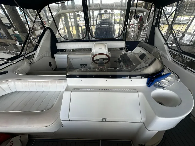 Slide: The Image of 1996 Sea Ray 440 Express Bridge interior with helm, seating, and controls. - 22