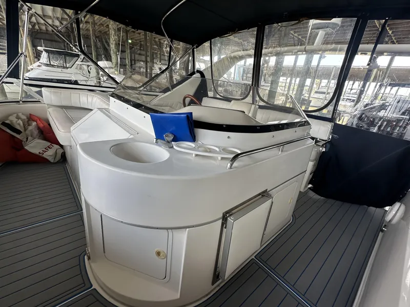 Slide: The Image of 1996 Sea Ray 440 Express Bridge interior with helm, seating, and safety equipment. - 27