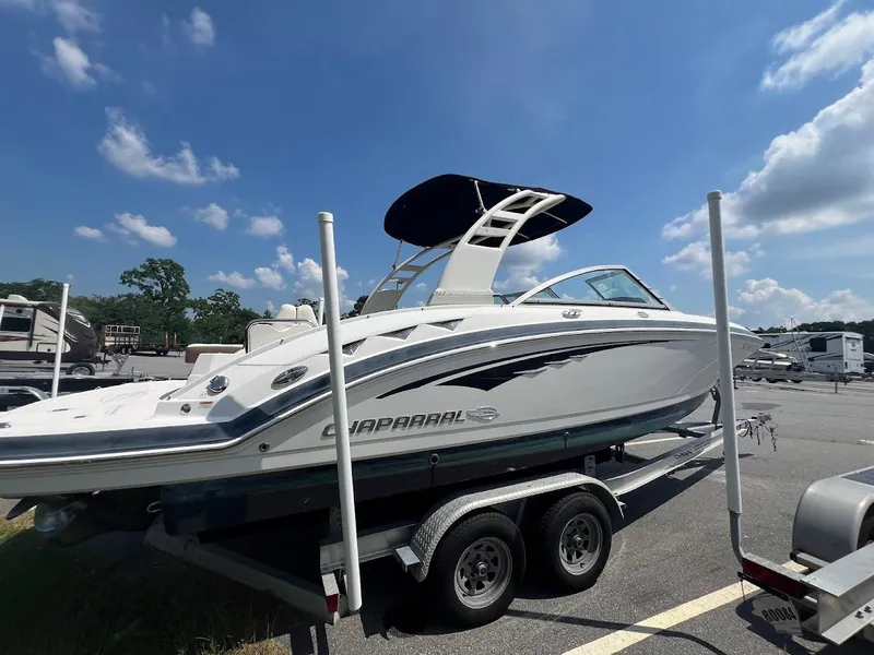 Slide: The Image of 2017 Chaparral 244 Sunesta boat on trailer under blue sky. - 10