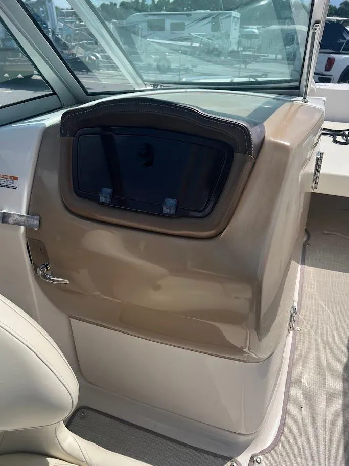 Slide: The Image of 2017 Chaparral 244 Sunesta boat interior with storage compartment and seating. - 7