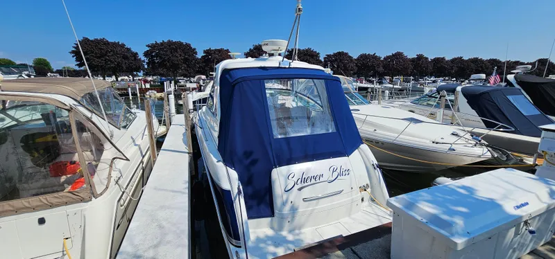 Slide: The Image of A 2007 Formula 37 Performance Cruiser docked in a busy marina. - 6