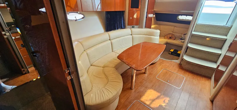 Slide: The Image of Interior of a 2007 Formula 37 Performance Cruiser with beige leather sofa and wooden table. - 35