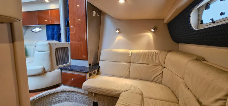 Slide: The Image of Interior of a 2007 Formula 37 Performance Cruiser with beige leather sofa and wooden cabinetry. - 52
