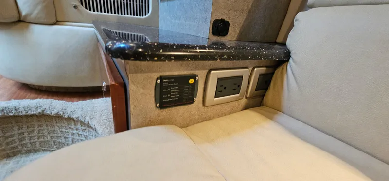 Slide: The Image of Interior of a 2007 Formula 37 Performance Cruiser with outlets and beige upholstery. - 53