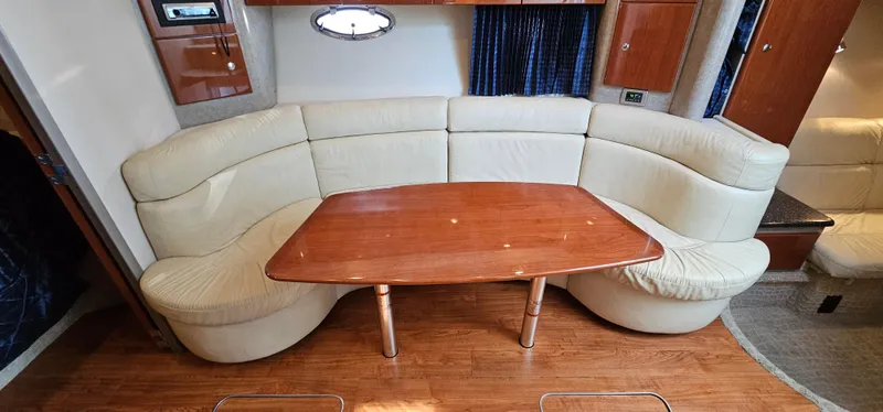 Slide: The Image of Interior of the 2007 Formula 37 Performance Cruiser with cream leather sofa and wooden table. - 33